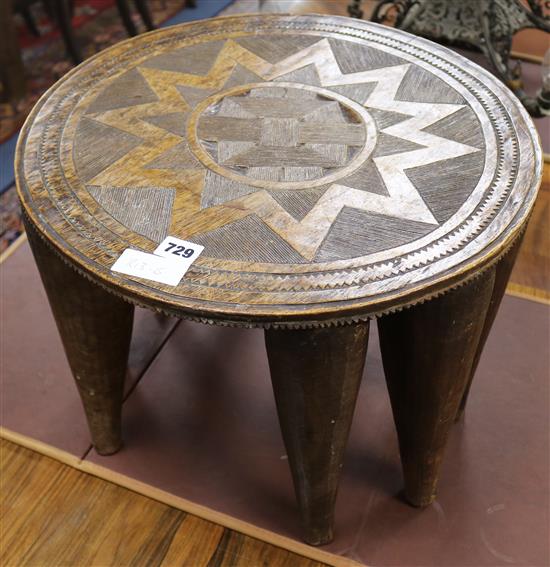 A tribal elephant leg table, W45cm